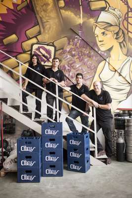 David Castro (bottom of the stairs) and his team at their Madrid brewery