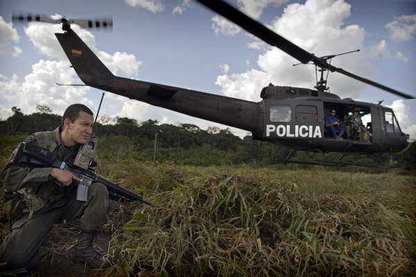 A helicopter lands in territory controlled by the guerilla group Farc