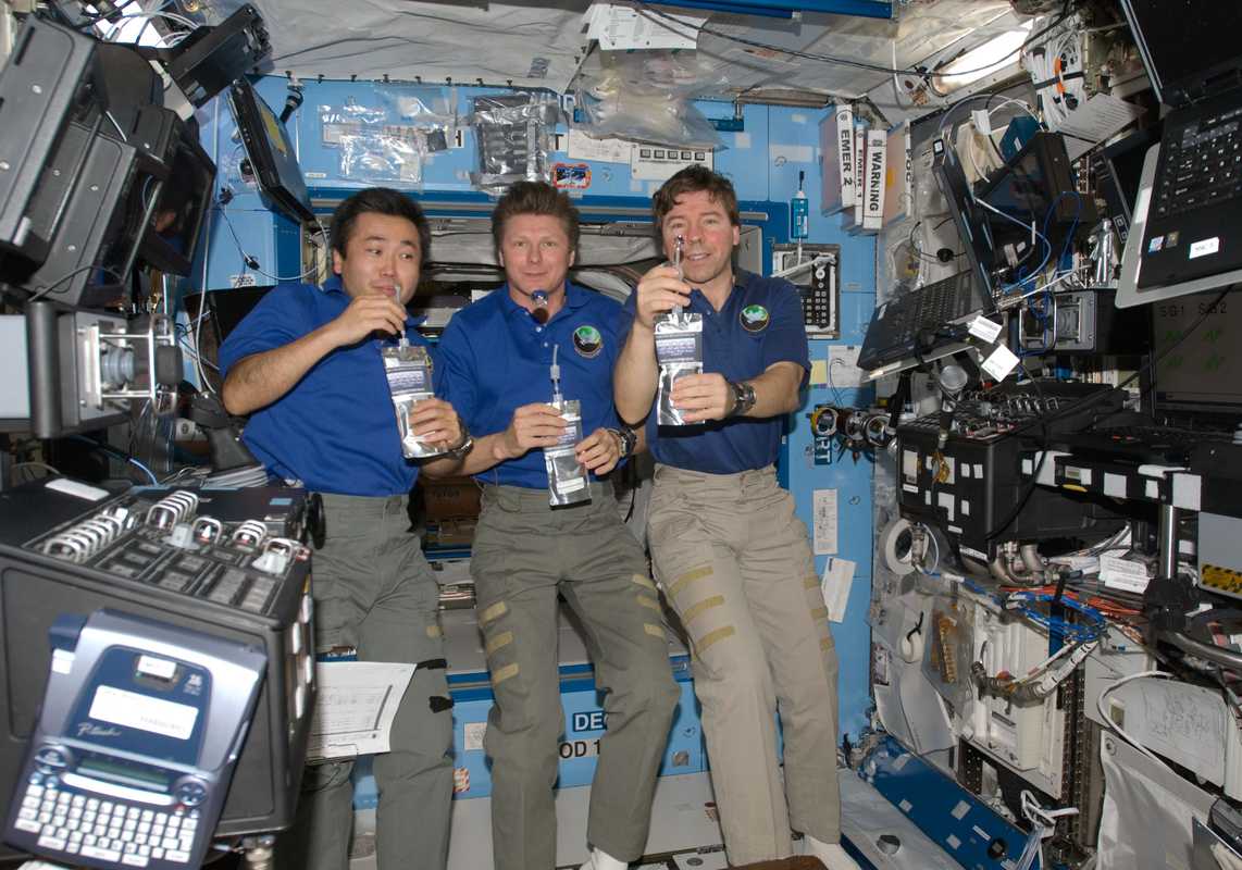 Wakata with fellow astronauts aboard the International Space Station
