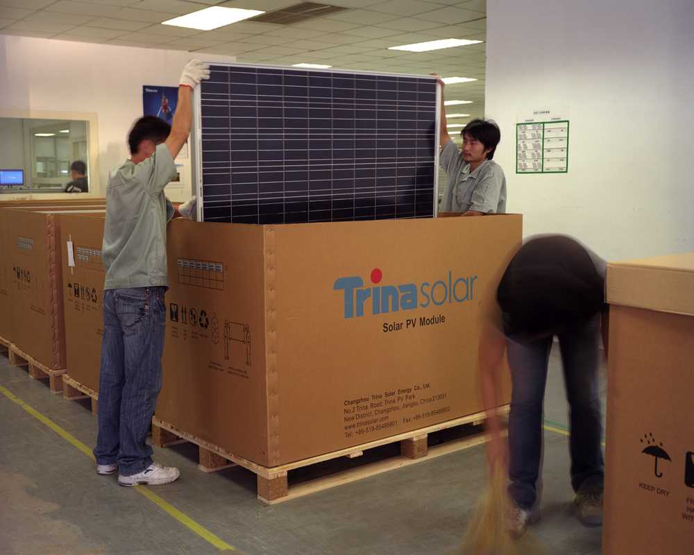Packing solar panels for shipment at Trina Solar