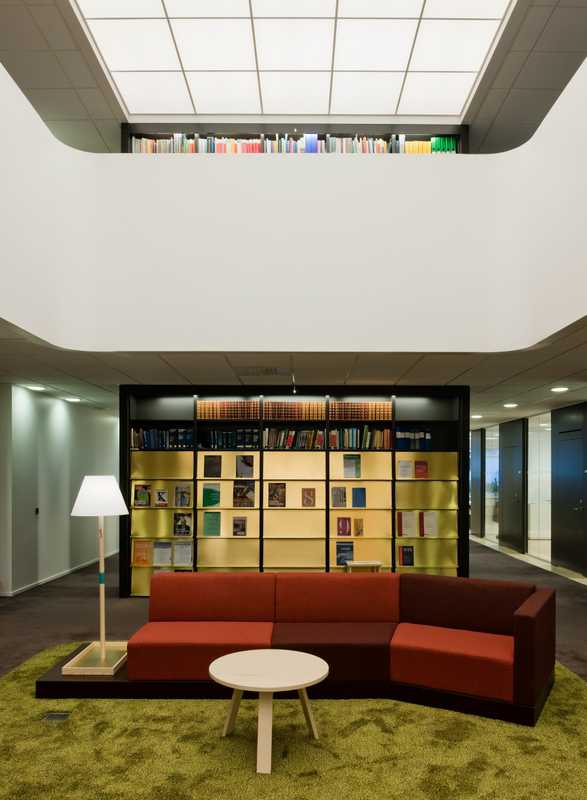 The library, featuring a back-lit glass ceiling and bespoke furniture by Martin-Löf