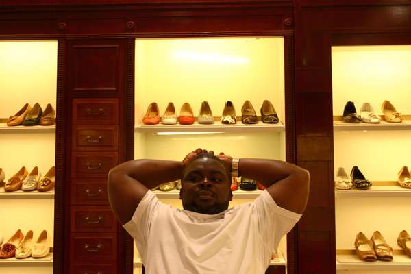Reuben, from Liberia, checks out the latest stock of luxury shoes