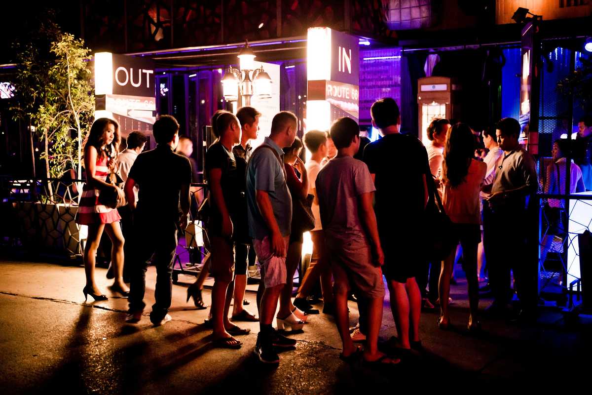 Fans queue for a club on Royal City Avenue (RCA)