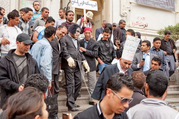 Protesters stage a mock trial of former president, Zine El Abidine Ben Ali