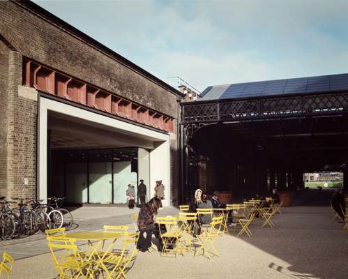 Students take a break in the sunshine outside the East Transit shed