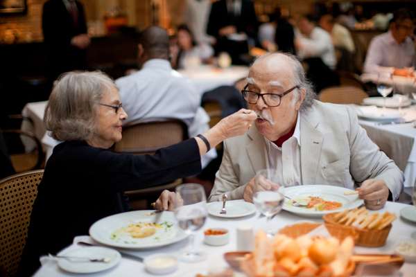 Sergio and Vera tasting each other’s dinner