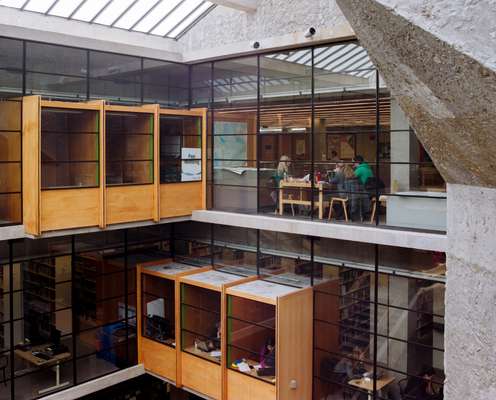 Bata Library’s interiors use wood and glass as a counterpoint to the concrete façade of the building 
