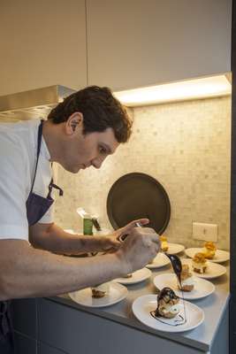 Chef Luciano Nardelli adding the final touch to a dessert