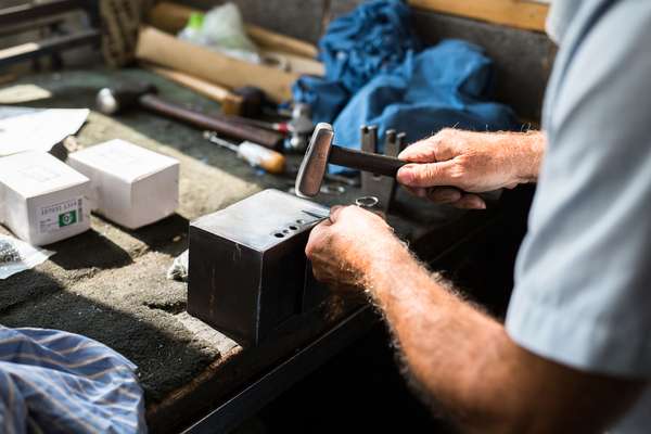 Final adjustments are made with a steel hammer