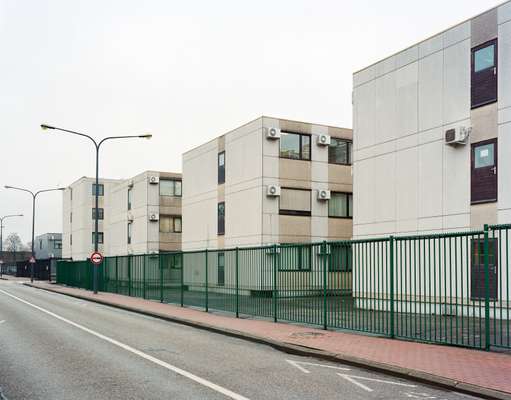 Prefab units piled on top of each other, complete with irrelevant door handles