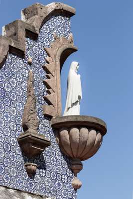 Religious figure on the side of the building