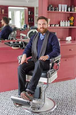Dan Lastre, manager of the barber shop in Common People