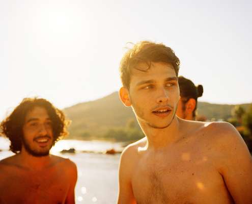 Friends about to somersault off the pier at Xuma Village 