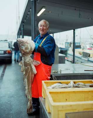 Fisherman Carl August Arge sells his weighty catch in Tórshavn harbour