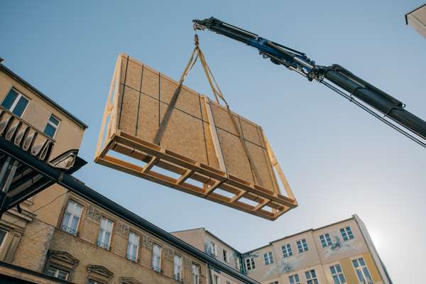 High art: part of an  installation being manoeuvred into the gallery