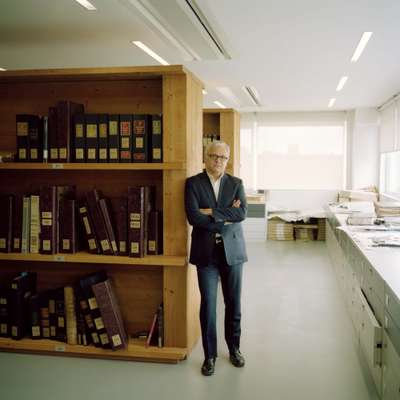 Francesco Gentili, owner of Gentili Mosconi, with his catalogued archives 