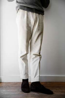 The label’s pleated trousers