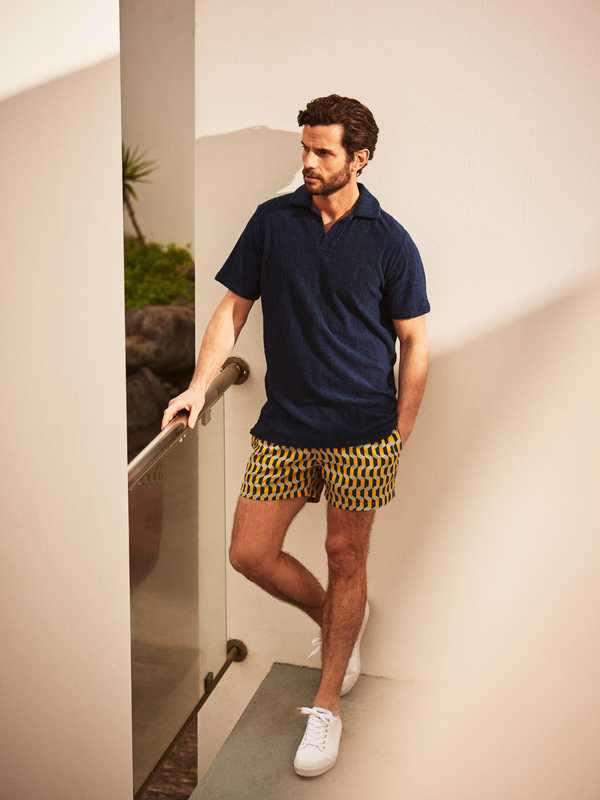 Polo shirt by The Gigi, swim shorts by Timo, trainers by Spring Court