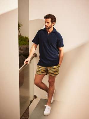 Polo shirt by The Gigi, swim shorts by Timo, trainers by Spring Court