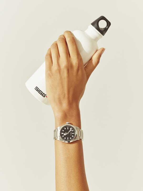 Watch by Tudor, water bottle by Sigg 