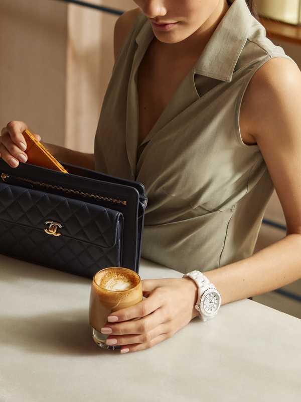 Blouse by Giuliva Heritage Collection, bag and watch by Chanel, card case by Ettinger