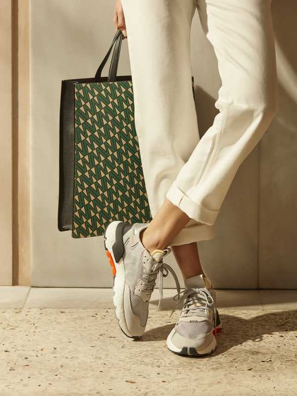 Jeans by Acne Studios, trainers by Adidas, bag by Valextra