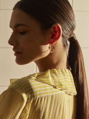 Blouse by Chanel, earrings by Dior