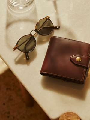 Sunglasses by Cubitts, wallet by Ettinger