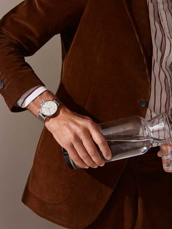 SUIT and SHIRT by Drake’s, TANGENTE SPORT NEOMATIK 42 DATE WATCH by Nomos Glashütte