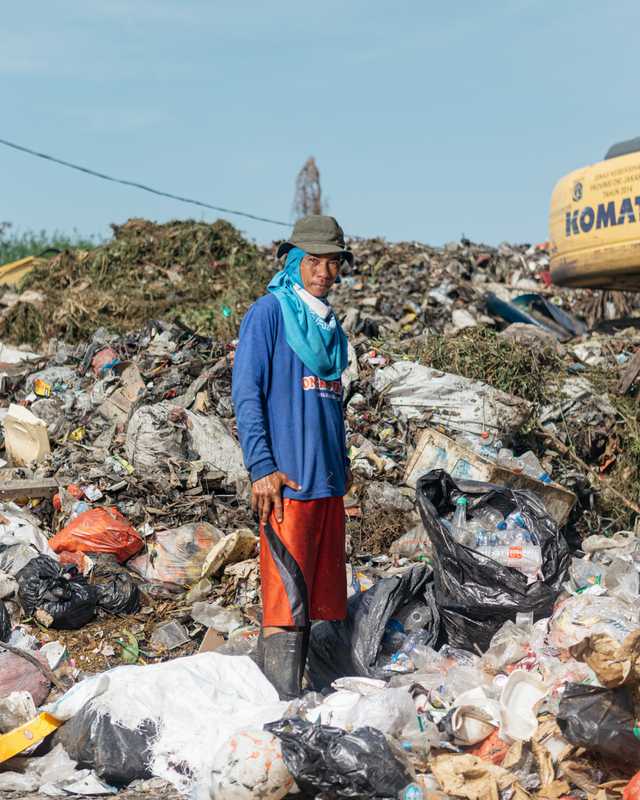Scavenging at a temporary rubbish dump in Puit, north Jakarta