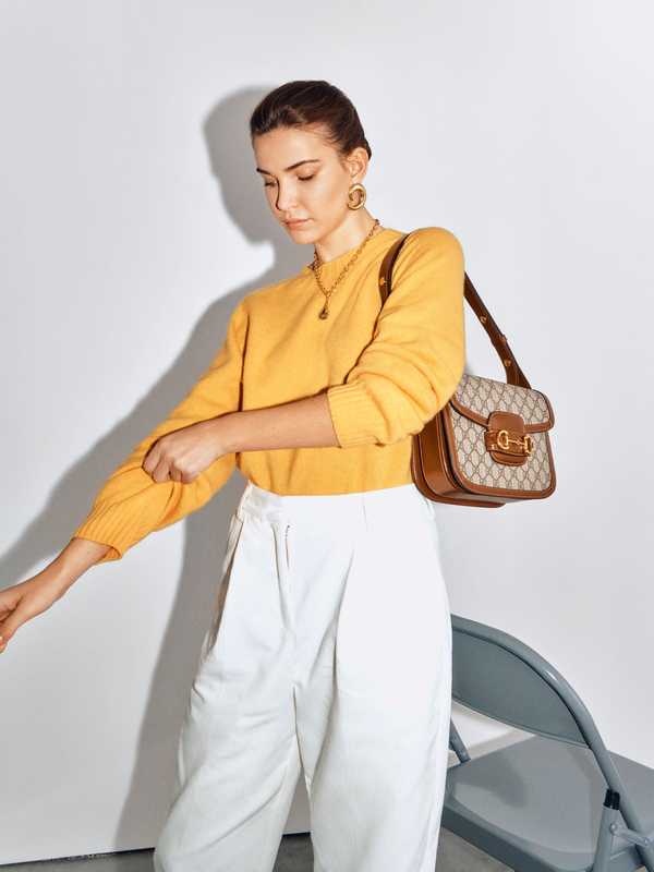 Jumper and trousers by YMC, earrings and necklace by Moya, bag by Gucci