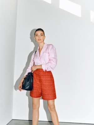 Shirt, shorts and bag by Chanel, earrings by Hermès