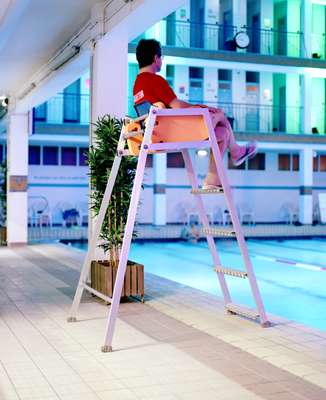 Lifeguard diligently watching on