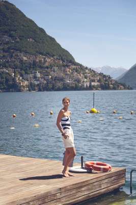 Swimwear by Oye, shorts by Maison Kitsuné, bracelet by Bottega Veneta, bag by Johanna Gullichsen from Trunk