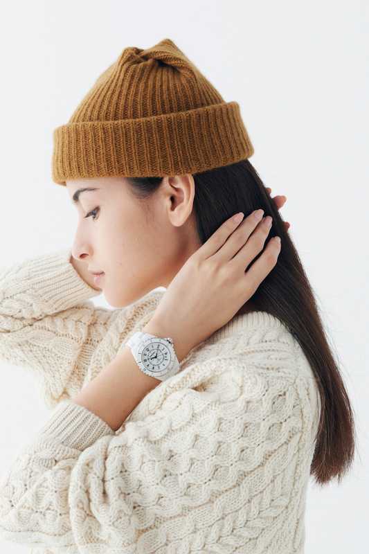 Jumper by Sunspel, beanie by Mature Ha, watch by Chanel