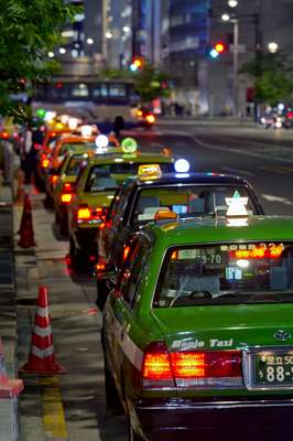 Taxicab queues snake around Shibuya Station