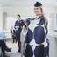 Instructor holding the new Marimekko-designed apron