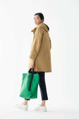 Coat by Orchival, trousers by Arket, trainers by Santoni, bag by Bagsinprogress