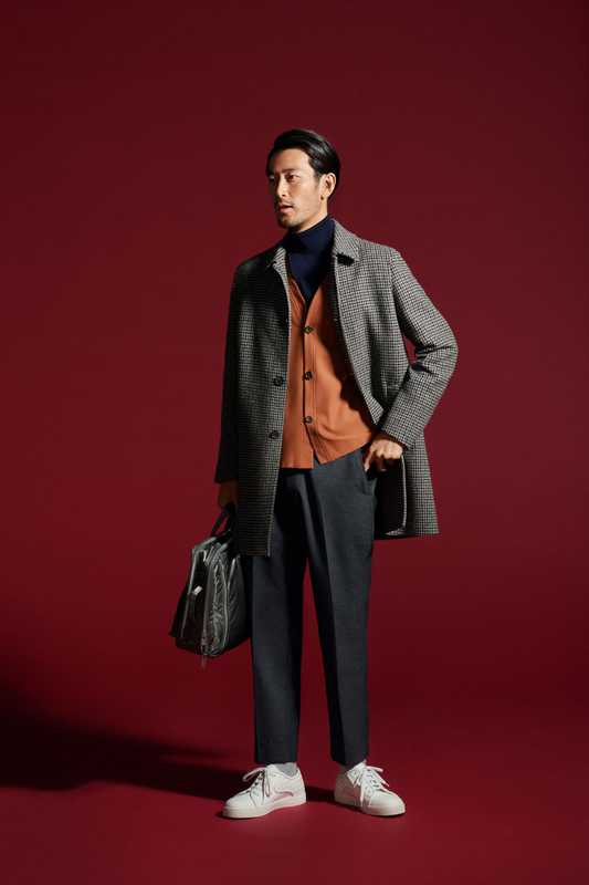 Coat by Altea, cardigan by Rainmaker, rollneck jumper by Sovereign from The Sovereign House, trousers by Allege, socks by Beams, trainers by Bottega Veneta, bag by Porter from Kura  Chika Yoshida