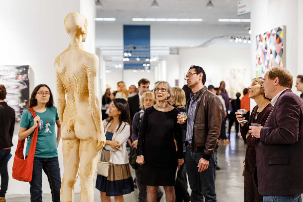 Attendees view 'Il Raccolto' by Aron Demetz