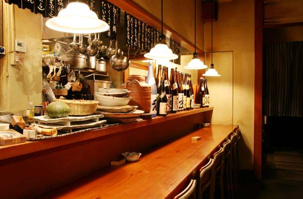 Counter seats in front of the kitchen