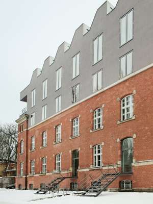 Two floors of studio and administration spaces have been added to the 1902 barracks building