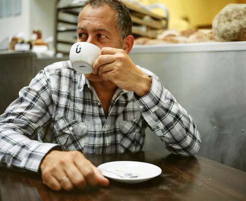 Nadav Kander drinks his half-decaf, half-regular coffee