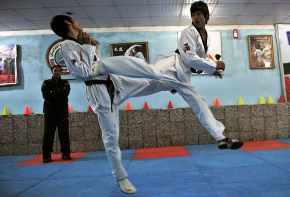 Sparring as coach watches closely