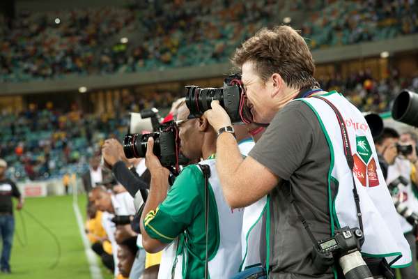 Photographers gathered by the pitch