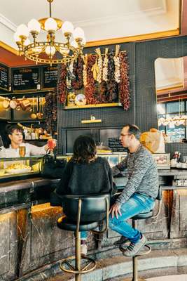 Café Comercial’s marble bar is a magnet for friendly catch-ups