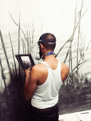 Frank Mujica at work on a large-format graphite drawing
