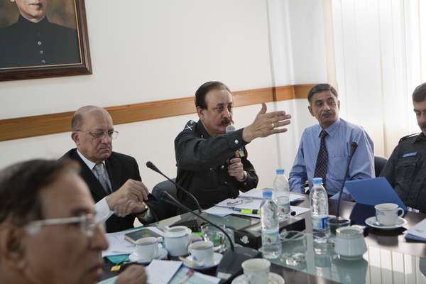 Ahmed in a meeting with fellow officers 