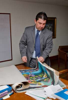 DNE investigator views confiscated paintings by well-known Colombian artist Alejandro Obregon ahead of their auction
