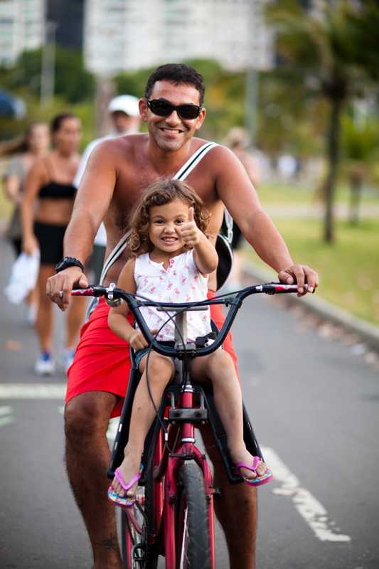Marcello and daughter Kiara, visiting family from Los Angeles, take a Rio ride